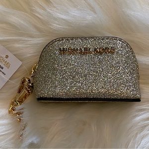 Michael Kors pale gold purse accessory.
